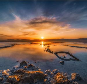 Scenic view of sea against sky during sunset