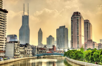 View of buildings against cloudy sky