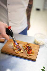 Man preparing food on cutting board