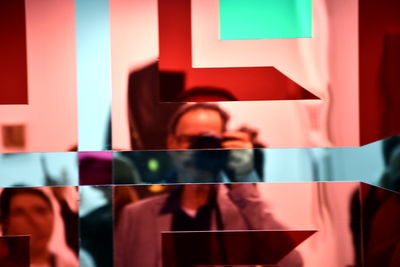 Low angle view of woman holding paper