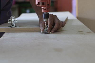Man working on cutting board