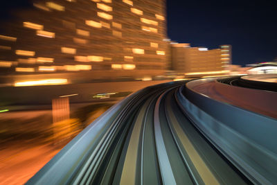 Blurred motion of light trails on road at night