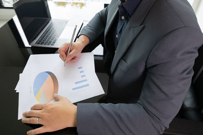 Working desk of young businessman manager who is working in professional career for analysing data 