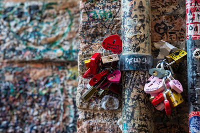 Close-up of padlocks attached on wall