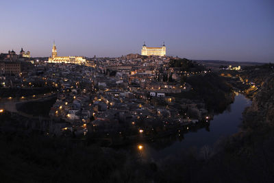 High angle view of city buildings at night