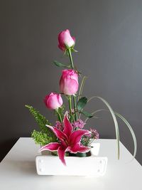 Close-up of pink flower vase on table