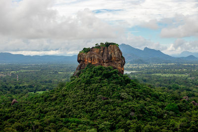 Rock formations on landscape against sky