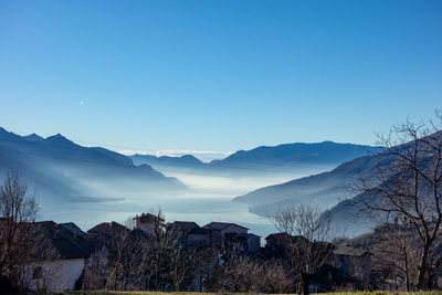 Scenic view of mountains against clear blue sky