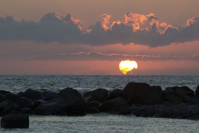 Scenic view of sea against sky during sunset