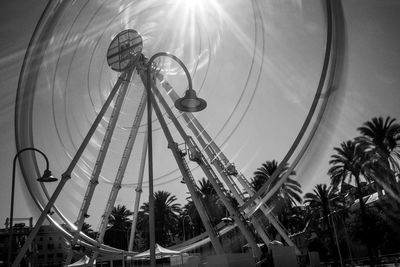 Low angle view of ferris wheel against sky