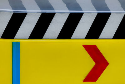 High angle view of yellow sign on road