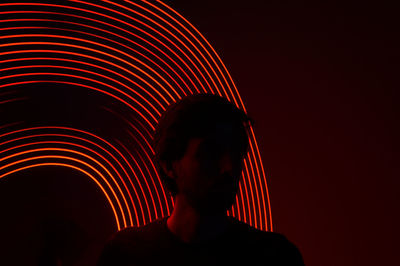 Portrait of silhouette man in illuminated nightclub