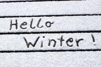 Close-up of text on snow