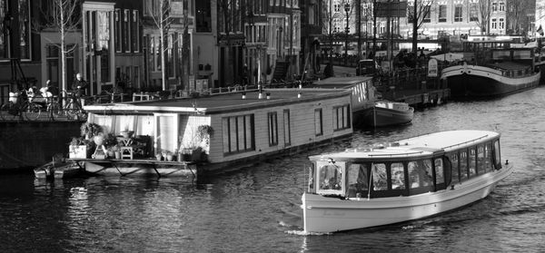 Boats sailing in city