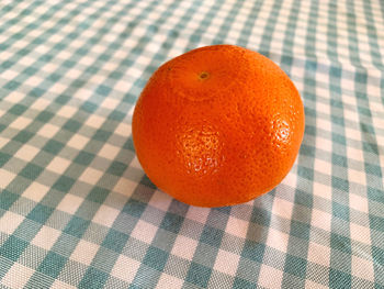 Close-up of orange fruit on table