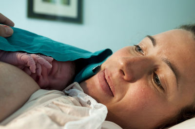 Close-up of mother with newborn son