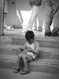 Boy playing with umbrella