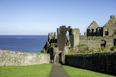 Castle at seaside against sky