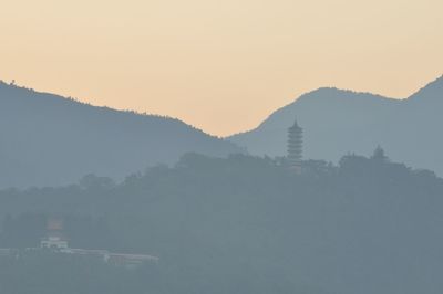 Scenic view of mountains against sky at morning