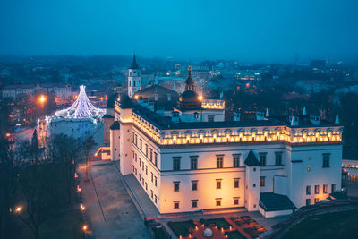 High angle view of illuminated buildings in city at night