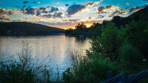 Scenic view of lake against sky during sunset
