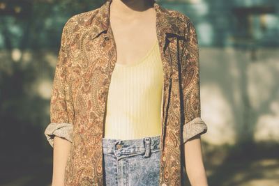 Midsection of woman wearing retro casual clothing