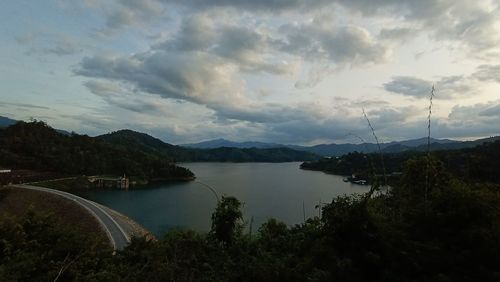 Scenic view of lake and mountains against sky