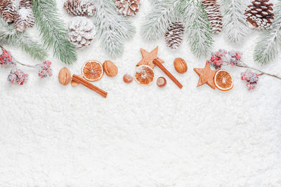 High angle view of christmas decorations on snow