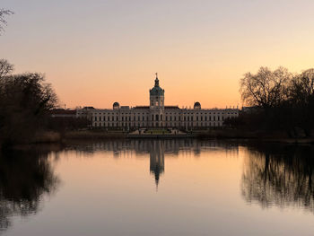 Reflection of charlottenburg palace in lake at dusk