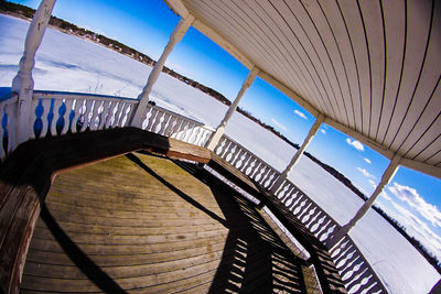 Empty railing against blue sky