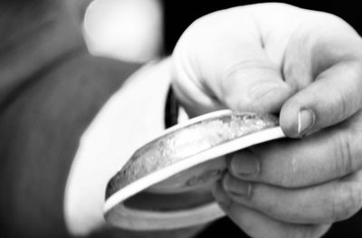 Close-up of hand holding cigarette