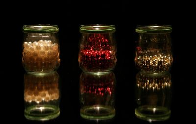 Close-up of jar against black background