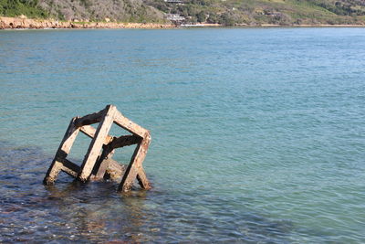 Abandoned boat in sea