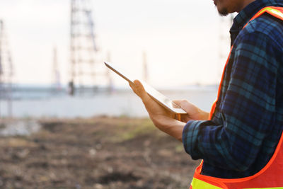 Side view of man using mobile phone