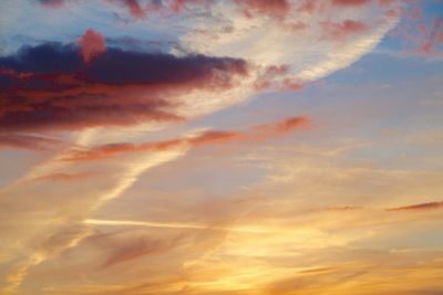 Low angle view of cloudy sky at sunset