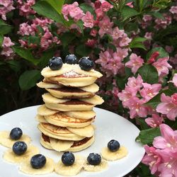 Stack of pancakes with banana and blueberry