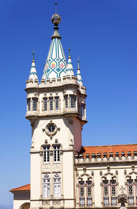 Low angle view of camara municipal against clear blue sky