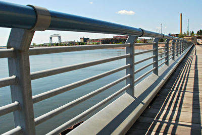 Close-up of railing against sky