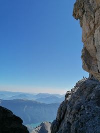 Scenic view of mountains against clear blue sky