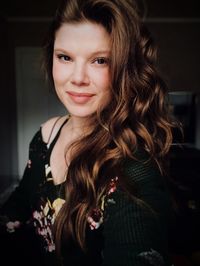 Portrait of smiling young woman at home