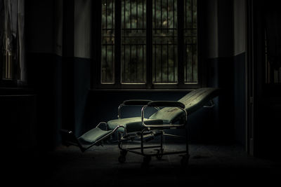 Empty medical chair in abandoned building 