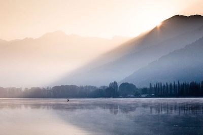 Scenic view of lake against sky during sunset