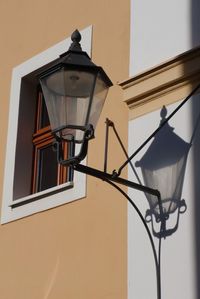 Low angle view of street light against sky