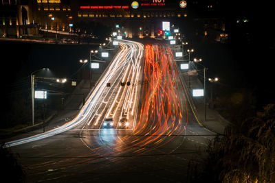 High angle view of light trails on road at night