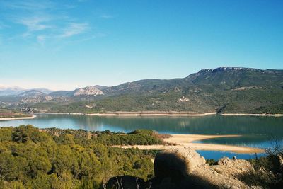 Scenic view of lake against blue sky