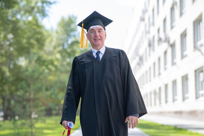 Portrait of woman wearing graduation