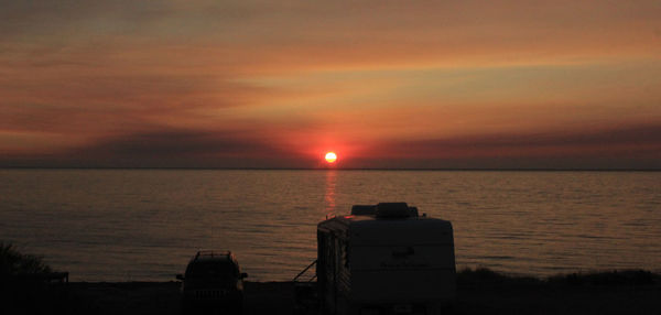 Scenic view of sea at sunset