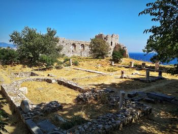 View of old ruin building against blue sky