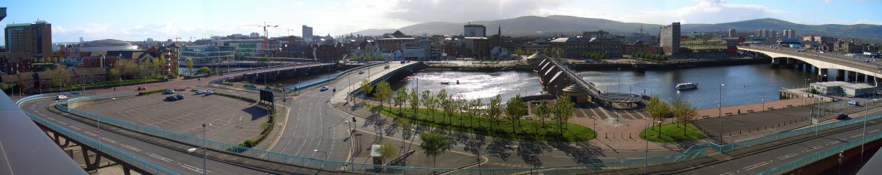 Boats in river with buildings in background