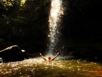 Man swimming in water